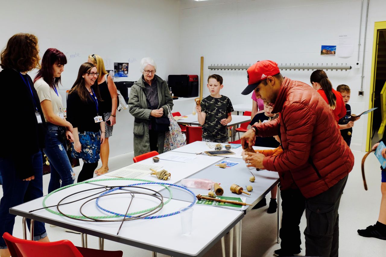 People looking at art activity during doors open day